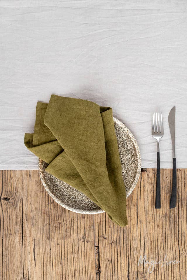 MagicLinen - Set of 2 linen napkins on a table with a fork and napkin, suitable for versatile table decor and sustainable dining.