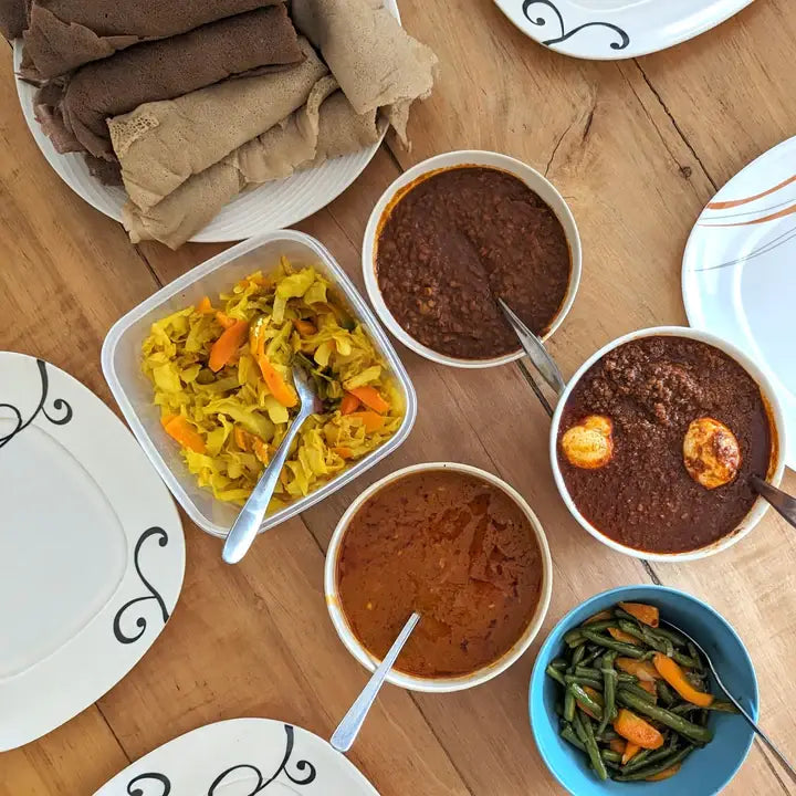 Burlap & Barrel - Berbere spice showcased with Ethiopian dishes, including doro wat and injera, highlighting its use in rich, aromatic stews and sides.