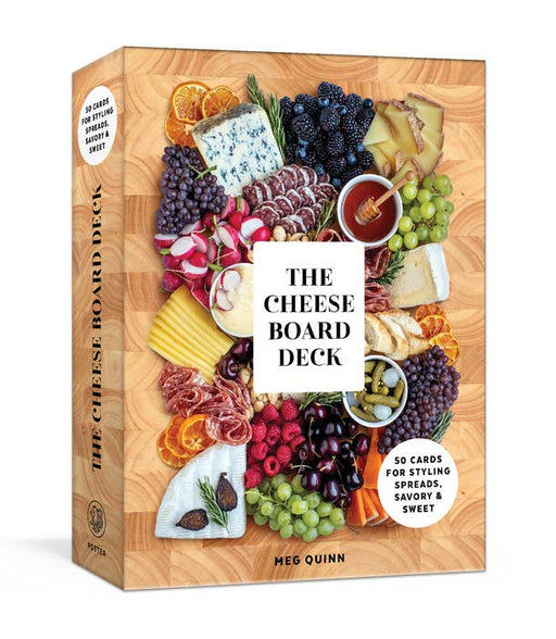 The Cheese Board Deck by Meg Quinn: Box cover showing an abundant cheese board with meats, fruits, nuts, and honey. Contains 50 cards for creative board styling.