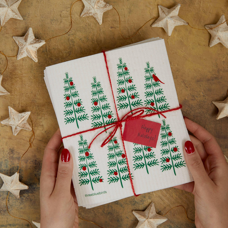 Three Bluebirds Swedish Dishcloths featuring a whimsical white and gold starfish design on a sturdy, biodegradable cloth, perfect for sustainable kitchen chores.