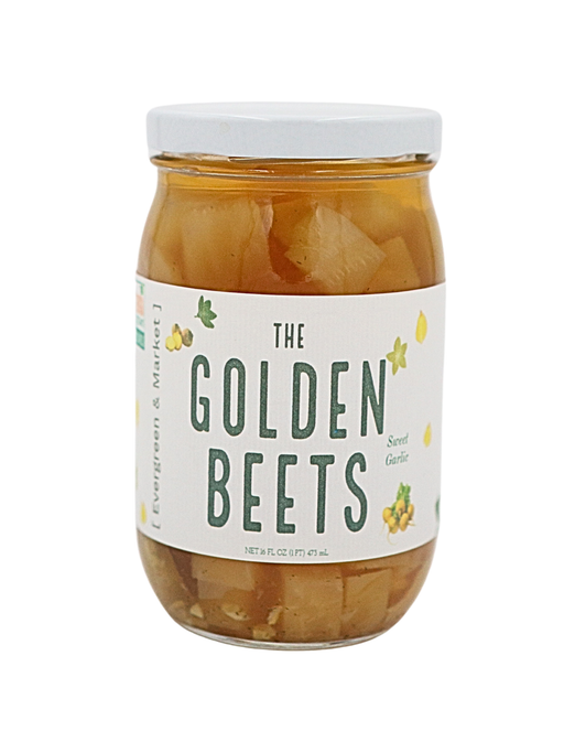 [PICKLES] by Evergreen and Market - The Golden Beets: A glass jar of sweet garlic-flavored pickled golden beets in brine, enhancing culinary creations.