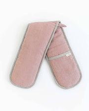 MagicLinen double oven mitt in a pink fabric, designed for heat protection. Part of a zero-waste program, showcasing sustainable kitchen accessories.