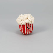 Ware of the Dog - Hand Knit Pop Corn Dog Toy, crafted from 100% lambswool with natural dyes, features a smiling plush popcorn tub design.