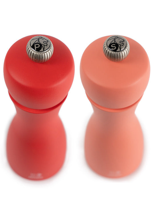 Peugeot | Tahiti Duo Salt + Pepper Mills, Fire, featuring adjustable metal knobs for grind settings, ideal for enhancing culinary creations.