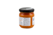 Matiz Romesco - 6.5oz jar with black lid, featuring a red-orange pepper and almond sauce, ideal for meats, seafood, and vegetables, reflecting Mediterranean culinary tradition.