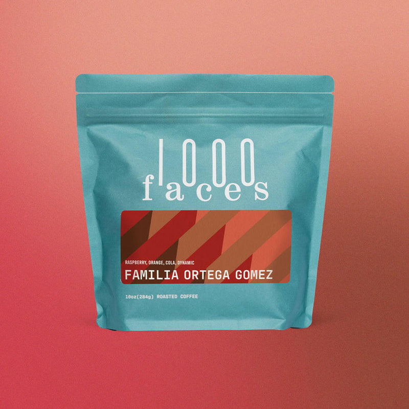1000 Faces Coffee - Winter Solstice, 10 oz blue bag with red and white label, showcasing a unique, sustainably produced blend.