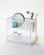 Yamazaki Home | Two-Tier Dish Rack, White, with customizable drying space, holding plates, mugs, utensils, and glasses, featuring a rotating drip tray and utensil holder.