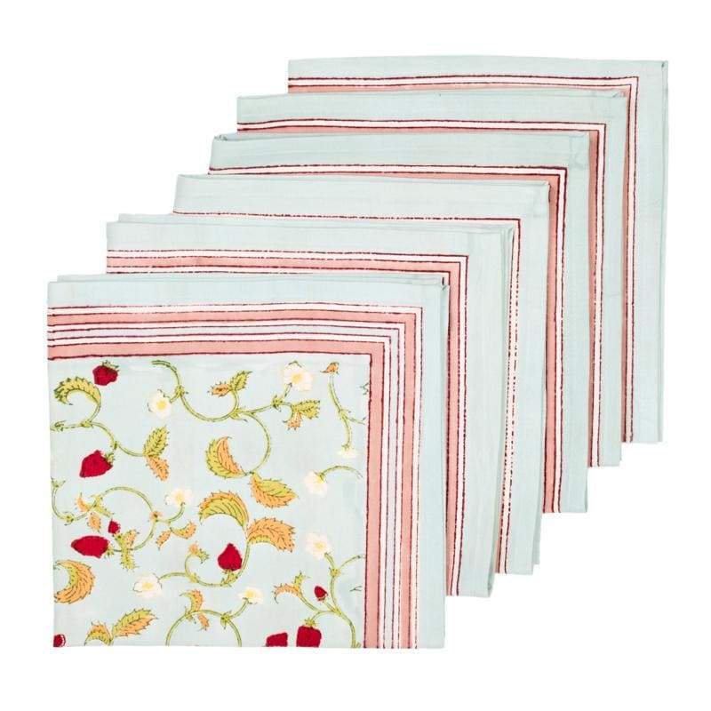 Caravan Home | 19 x 19 Fraises des Bois Blue Napkins Set of 6, featuring handprinted botanical designs on a neatly folded stack, perfect for elegant table settings.