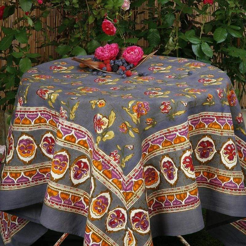 Caravan Home 71 x 106 Pansy Red & Grey Tablecloth with floral and abstract designs, creating a sophisticated table setting with artisanal, handprinted French linen.