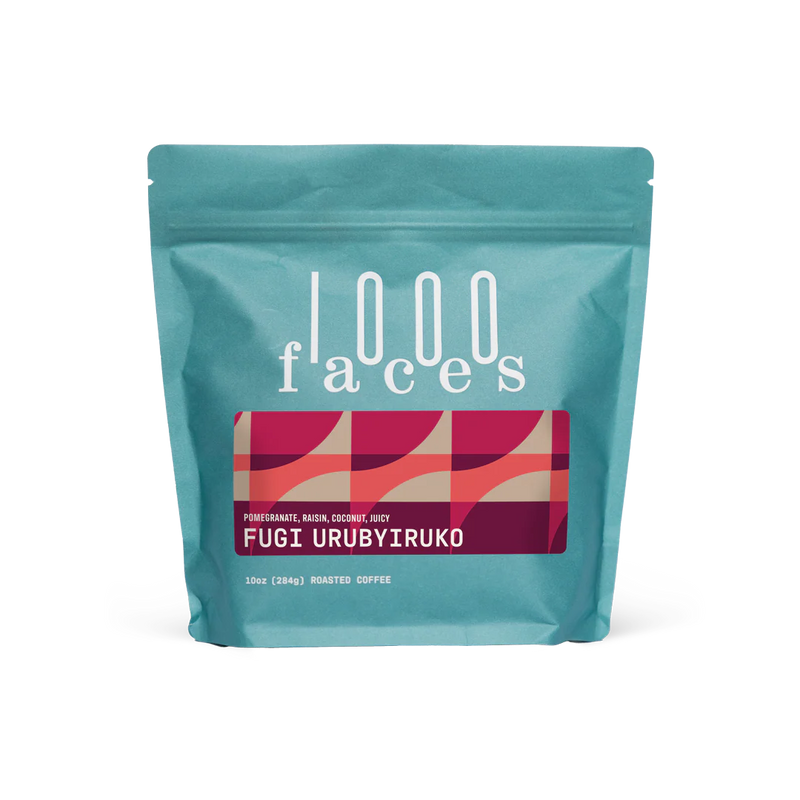 1000 Faces Coffee | Fugi Urubyiruko, 10 oz stand-up pouch showcasing roasted coffee with pomegranate, raisin, and coconut notes, ideal for specialty food enthusiasts.