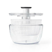 OXO Good Grips Salad Spinner with non-slip knob and base, featuring a spinning basket that doubles as a colander, ideal for drying and serving greens.