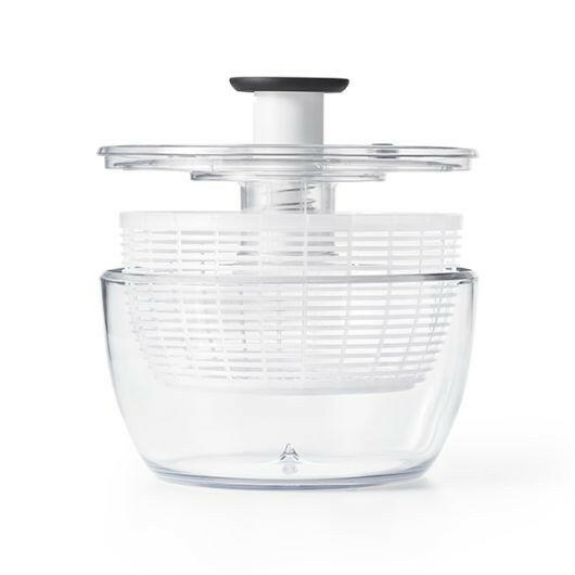 OXO Good Grips Salad Spinner with non-slip knob and base, featuring a spinning basket that doubles as a colander, ideal for drying and serving greens.