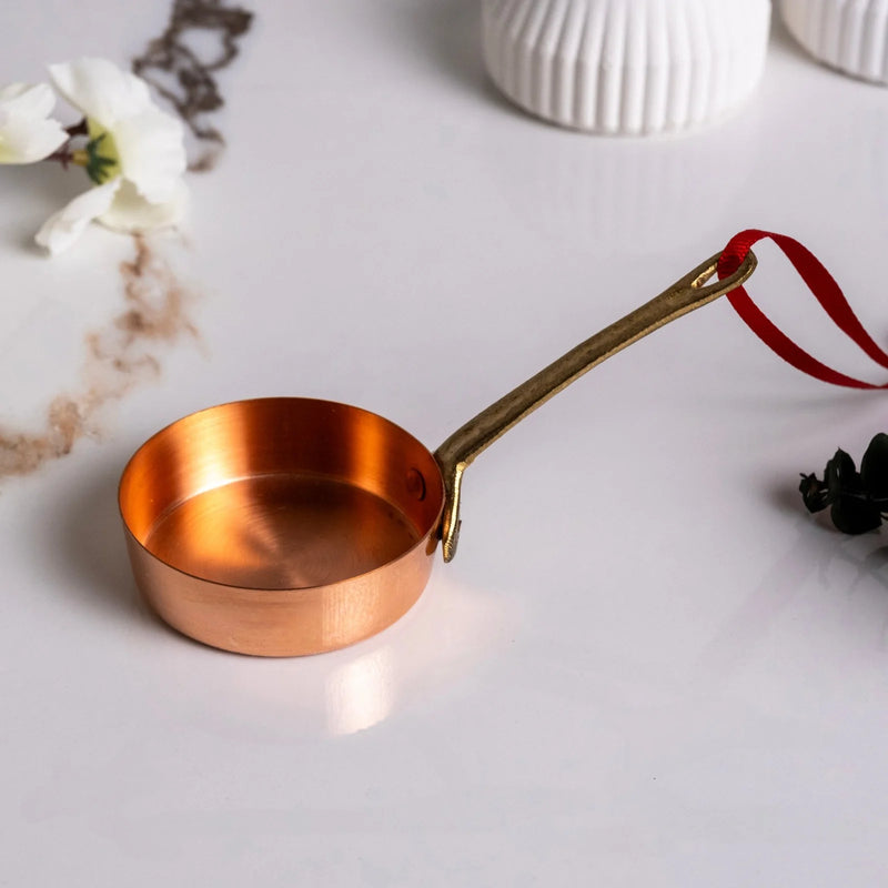 ALFIQ | Handmade Copper Miniature Kitchen Utensil Ornament, Sauce Pan, with brass handle and red ribbon, perfect for holiday decor or kitchen display.