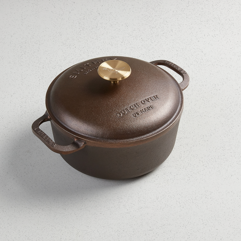 Smithey 3.5-quart cast iron Dutch oven with domed lid and gold-toned knob