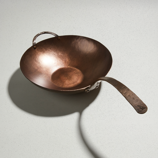 Smithey carbon steel wok with hammered bowl, flat base and forged handle