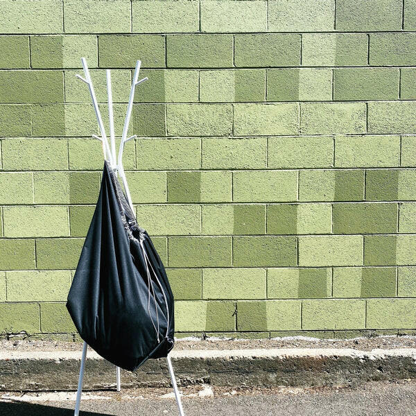 Marley's Monsters Washable Pail Liner - Large, featuring durable, water-resistant PUL fabric with a drawstring closure and cotton strap for versatile hanging and eco-friendly use.