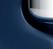 Close-up of a sleek dark-blue Ankarsrum stand mixer corner, showcasing its modern design and precision craftsmanship, perfect for heavy-duty kitchen tasks.