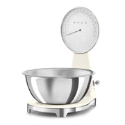 Smeg Kitchen Scale with analog and digital display, featuring a removable stainless-steel bowl, ideal for precise cooking in style.