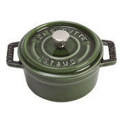 Staub | Mini Round Dutch Oven, Basil, 0.25 QT. A small, lidded cast-iron pot with handles, ideal for single-serve dishes like molten chocolate cake or French onion dip.