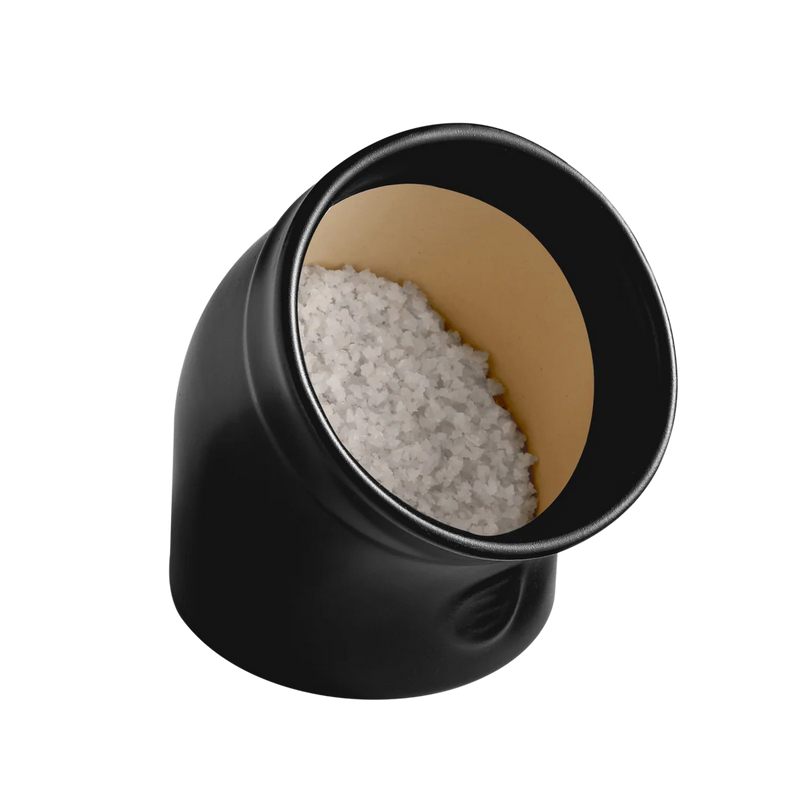 Emile Henry | The Salt Pig: A sleek black container filled with coarse white salt, designed for easy access and clump-free seasoning in your kitchen.