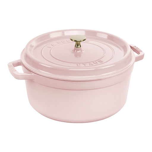 Staub | Round Dutch Oven, Pink Peony, 5.5 QT. features a snug-fitting lid, side handles, and a metal knob, perfect for versatile cooking.