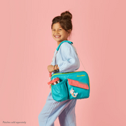Young girl smiling, carrying a PlanetBox | Rover-Launch Carry Bag - Watermelon, featuring a mermaid/unicorn patch, showcasing its functionality for lunch essentials.