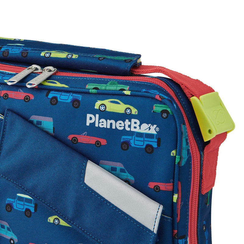 PlanetBox | Rover & Launch Carry Bag, Traffic Jam: Close-up of an insulated lunch bag with colorful car pattern, featuring red zippers and strap, ideal for organizing meals.