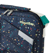 PlanetBox | Rover-Launch Carry Bag - Splatter Paint: Navy-blue tote with multicolored paint dots, featuring a zippered top, front logo pocket, and adjustable shoulder strap.