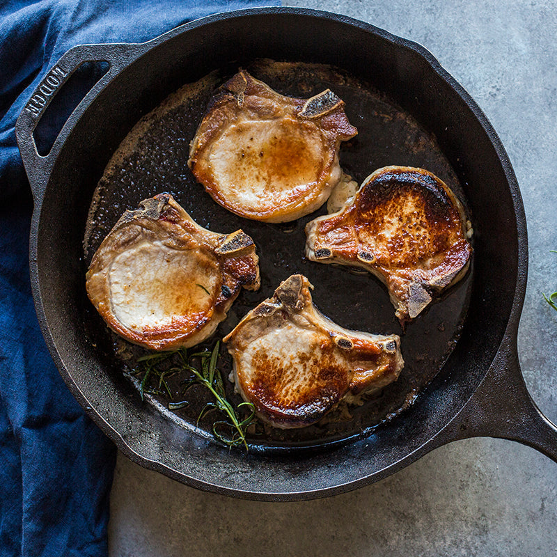 Lodge | Classic Cast Iron Skillets - 15 close-up, showcasing its seasoned surface, ideal for versatile cooking, embodying durability and tradition.