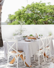 MagicLinen linen tablecloth, 59 x 98 inches, elegantly complements dining setups, suitable for casual or formal occasions, with contemporary seam finish for easy pairing.