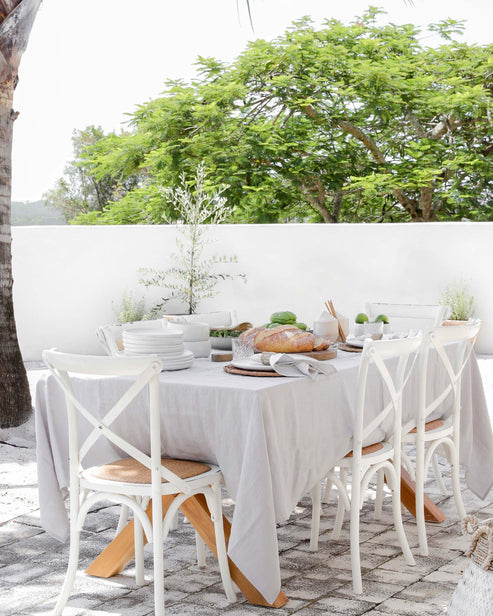 MagicLinen linen tablecloth, 59 x 98 inches, elegantly complements dining setups, suitable for casual or formal occasions, with contemporary seam finish for easy pairing.