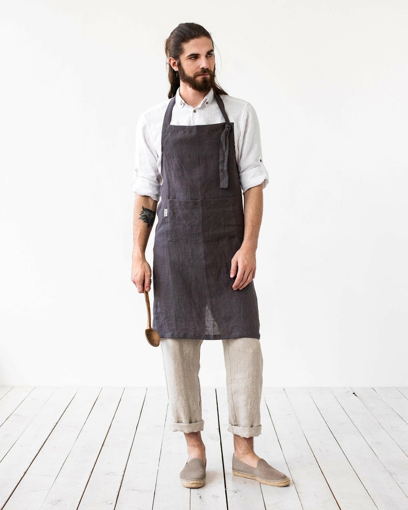 MagicLinen Men's Linen Bib Apron in Charcoal Gray, featuring adjustable straps and a twin-sectioned front pocket, ideal for cooking and gardening enthusiasts.