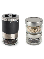 Peugeot Maestro Pepper Bar with black pepper mill and stackable glass jars, showcasing premium black and white peppercorns for culinary exploration.