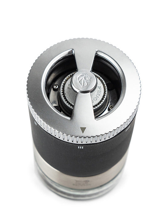 Peugeot Maestro Pepper Bar: stainless-steel hand-crank grinder with adjustable settings, featuring interchangeable jars and three premium pepper varieties for culinary exploration.