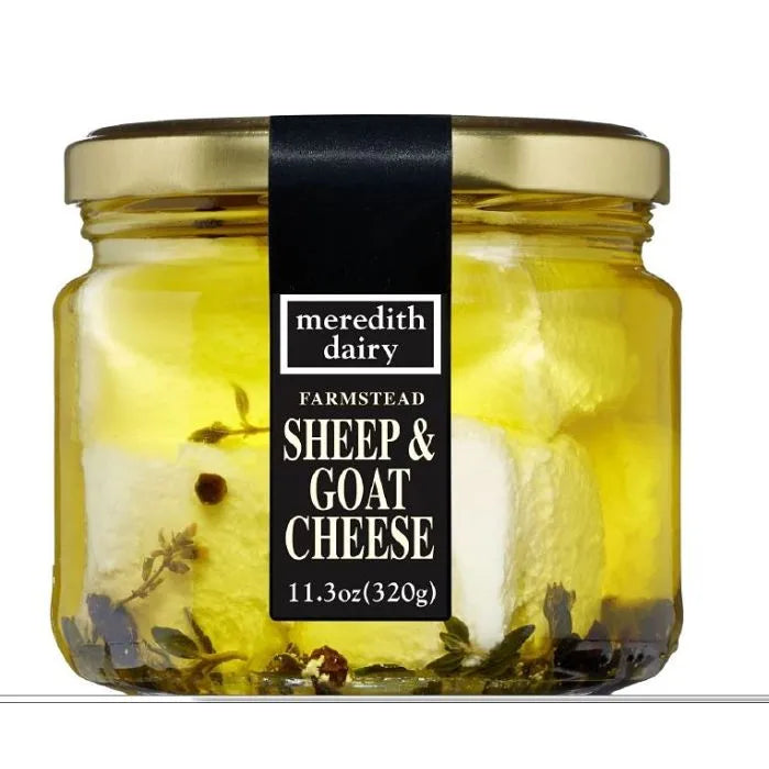 Meredith's Dairy Marinated Goat & Sheep Feta in oil with herbs and peppercorns, packaged in a glass jar, 11.3 oz.