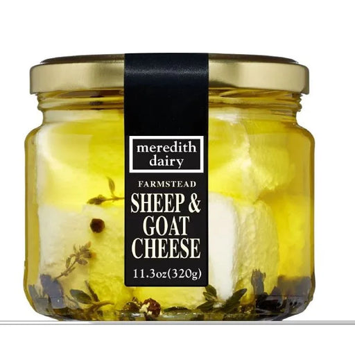 Meredith's Dairy Marinated Goat & Sheep Feta in oil with herbs and peppercorns, packaged in a glass jar, 11.3 oz.
