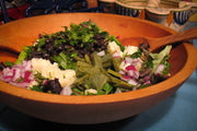 Rancho Gordo | Midnight Black Bean in a salad with black beans and cheese, showcasing its creamy texture and versatility.