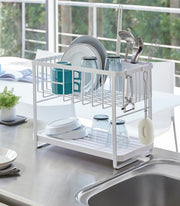 Yamazaki Home | Two-Tier Dish Rack, White: Efficient drying solution featuring customizable tiers, utensil holder, and rotating draining spout for optimal kitchen organization.