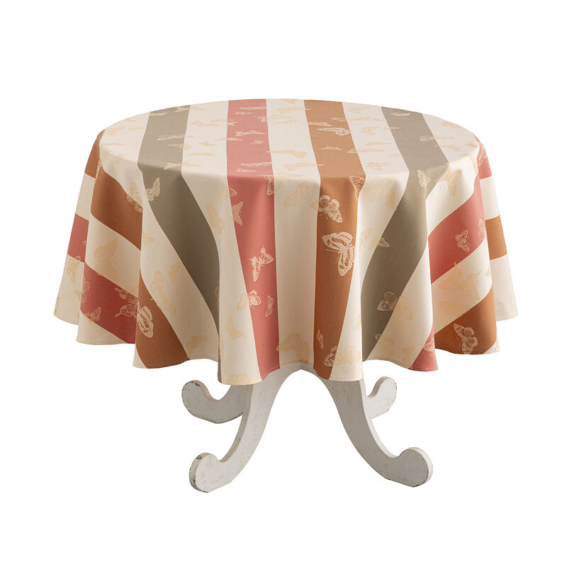 Le Jacquard Francais | Bal Des Papillons Tablecloth features muted earth tones with a butterfly motif, elegantly draped over a whitewashed pedestal table.
