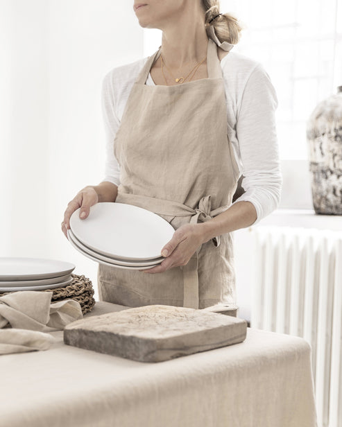 MagicLinen forest green linen tablecloth, 59 x 98 inches, with simple seam finish, ideal for enhancing dining settings at Athens Cooks kitchen store.