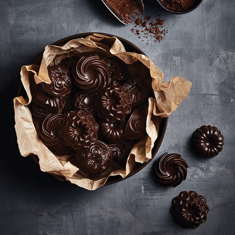 Nordic Ware | Mini Bundt Charms Pan showcasing six intricate Bundt designs for creating cakes, candies, and more. Ideal for baking enthusiasts at Athens Cooks.
