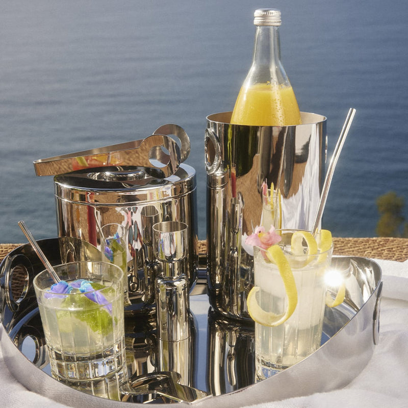 Christofle | Wine Cooler, Stainless Steel, elegantly set on a tray with cocktails, showcasing its modern design and versatility for stylish entertaining by the water.