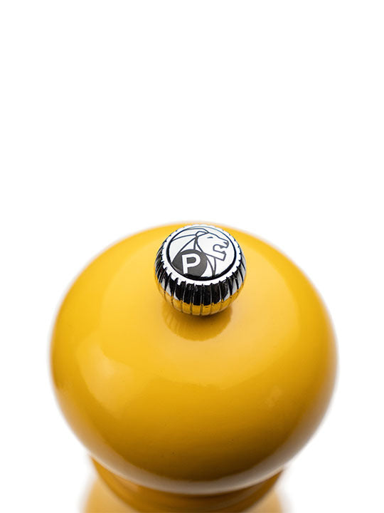 Peugeot | Paris U'Select Saffron Pepper Mill, 7 inches, featuring a metal adjustment knob with Peugeot logo, showcasing its precise grind control ring on a white background.