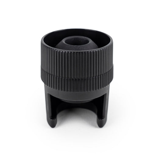 Peugeot Preserve Champagne Stopper, a sleek black object designed for sealing champagne bottles, ideal for preserving freshness.