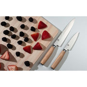 Shun Premier Blonde Utility Knife, 6.5, with stainless hammered blade and light-wood handle, displayed beside blackberries and strawberries on a cutting board.