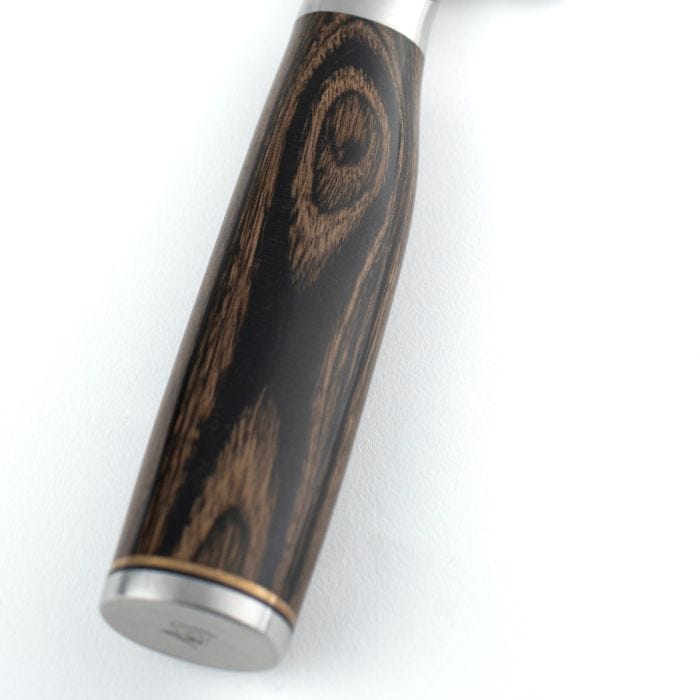 Shun | Premier Boning + Filet knife handle with polished wood-grain grip, metal bolster, and end cap, showcasing craftsmanship ideal for precise kitchen tasks.