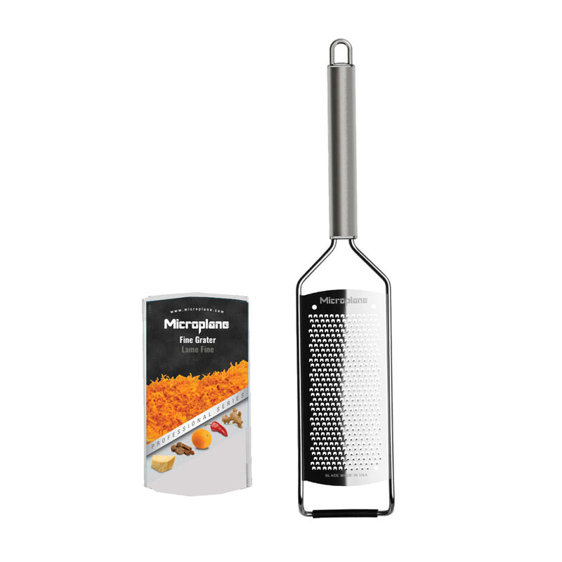 Microplane Professional Series Fine Grater with packaging, showcasing a sleek, stainless-steel design and fine-cut blade for precision grating, ideal for both home and professional kitchens.