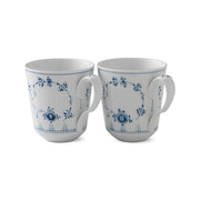 Royal Copenhagen | Blue Fluted Plain Cups, Set of 2: Two white porcelain mugs featuring a fluted surface and intricate blue floral design, ideal for serving hot beverages.