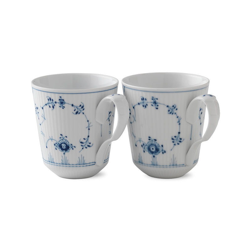 Royal Copenhagen | Blue Fluted Plain Cups, Set of 2: Two white porcelain mugs featuring a fluted surface and intricate blue floral design, ideal for serving hot beverages.
