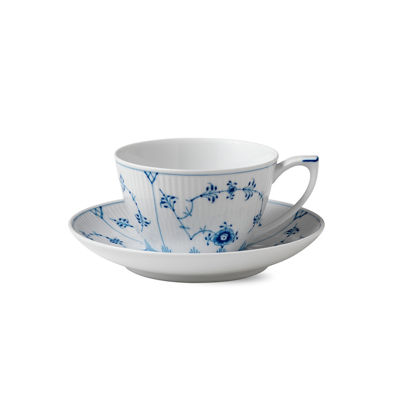 Royal Copenhagen | Blue Fluted Plain Cup & Saucer 28cl, featuring a delicate blue floral pattern on ribbed porcelain, ideal for an elegant tea or coffee setting.